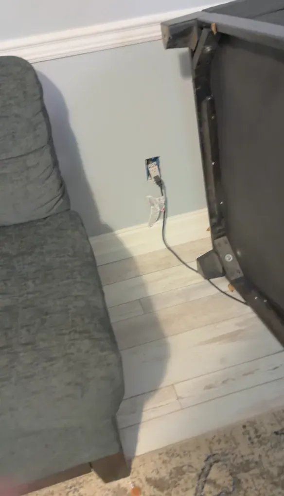 Sectional sofa pieces pulled away from the wall for deep cleaning